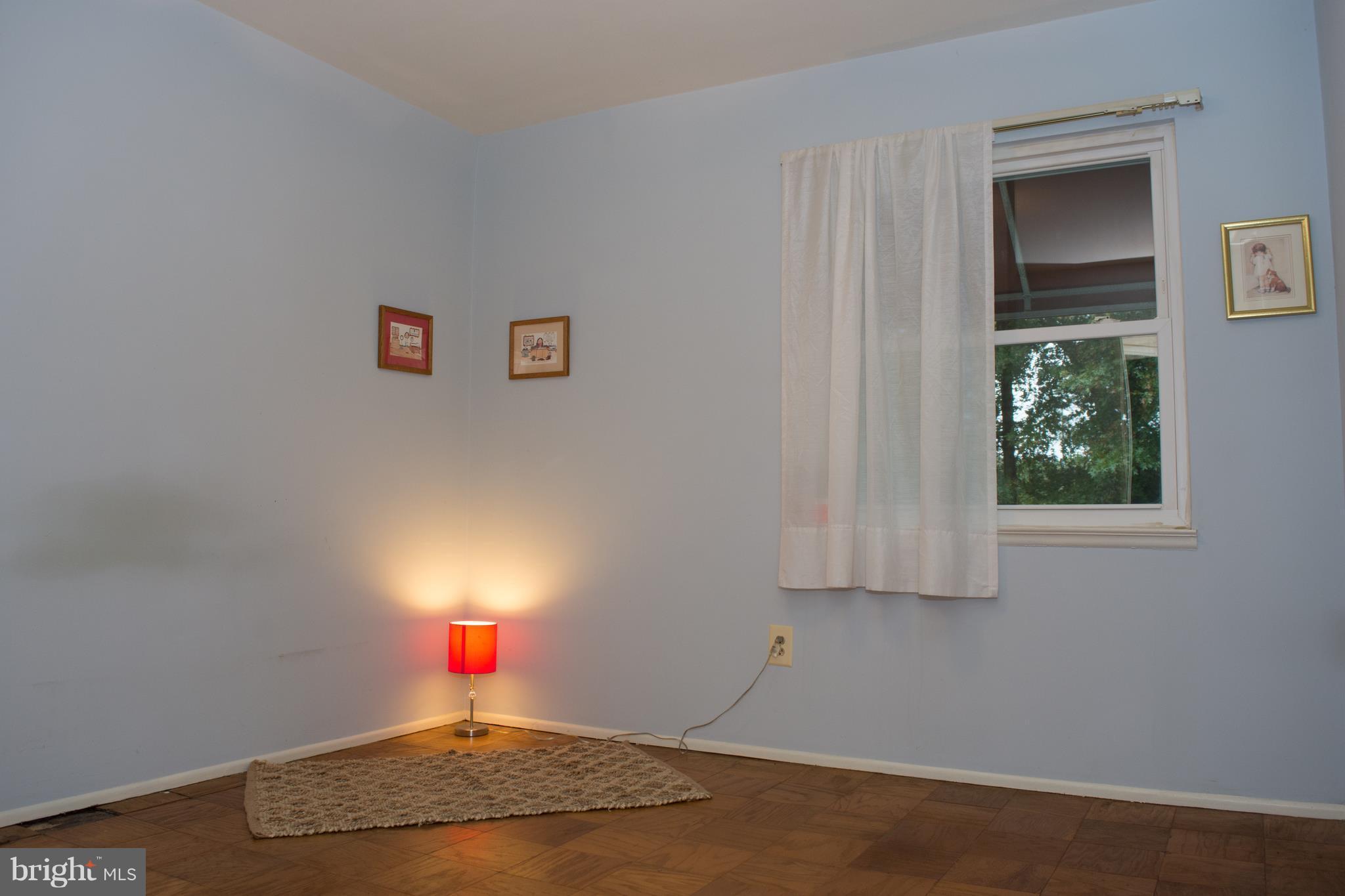 6217 Frontier Drive Springfield, VA 22150 - Photo 16 of 25 Second BR with window view of the rear of house