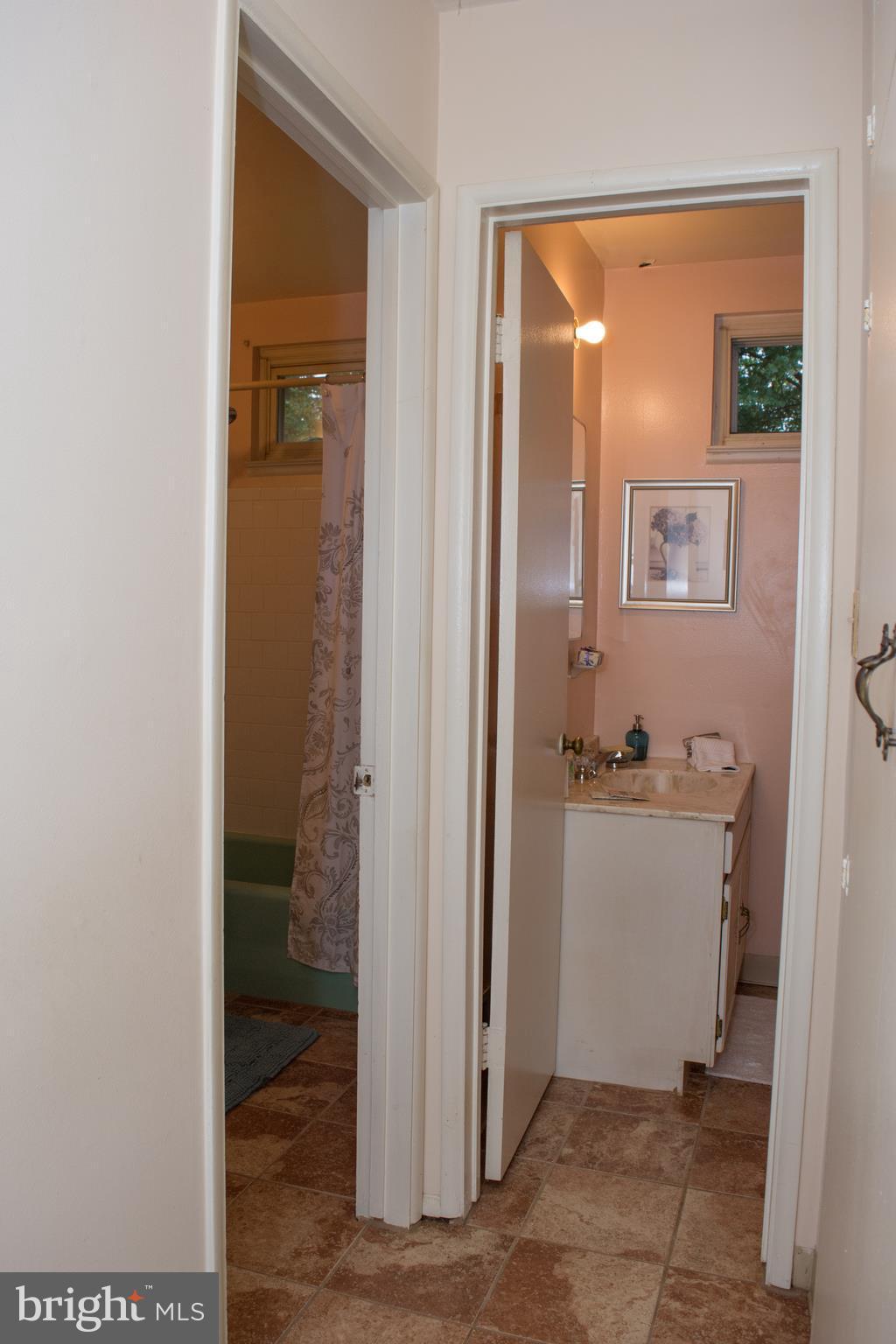 6217 Frontier Drive Springfield, VA 22150 - Photo 5 of 25 Hall to Baths with ceramic tile floor