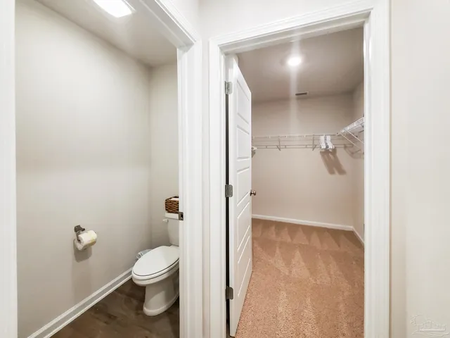 a bathroom with a granite countertop shower
