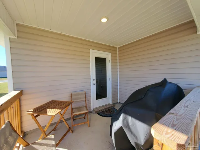 a backyard of a house with seating space