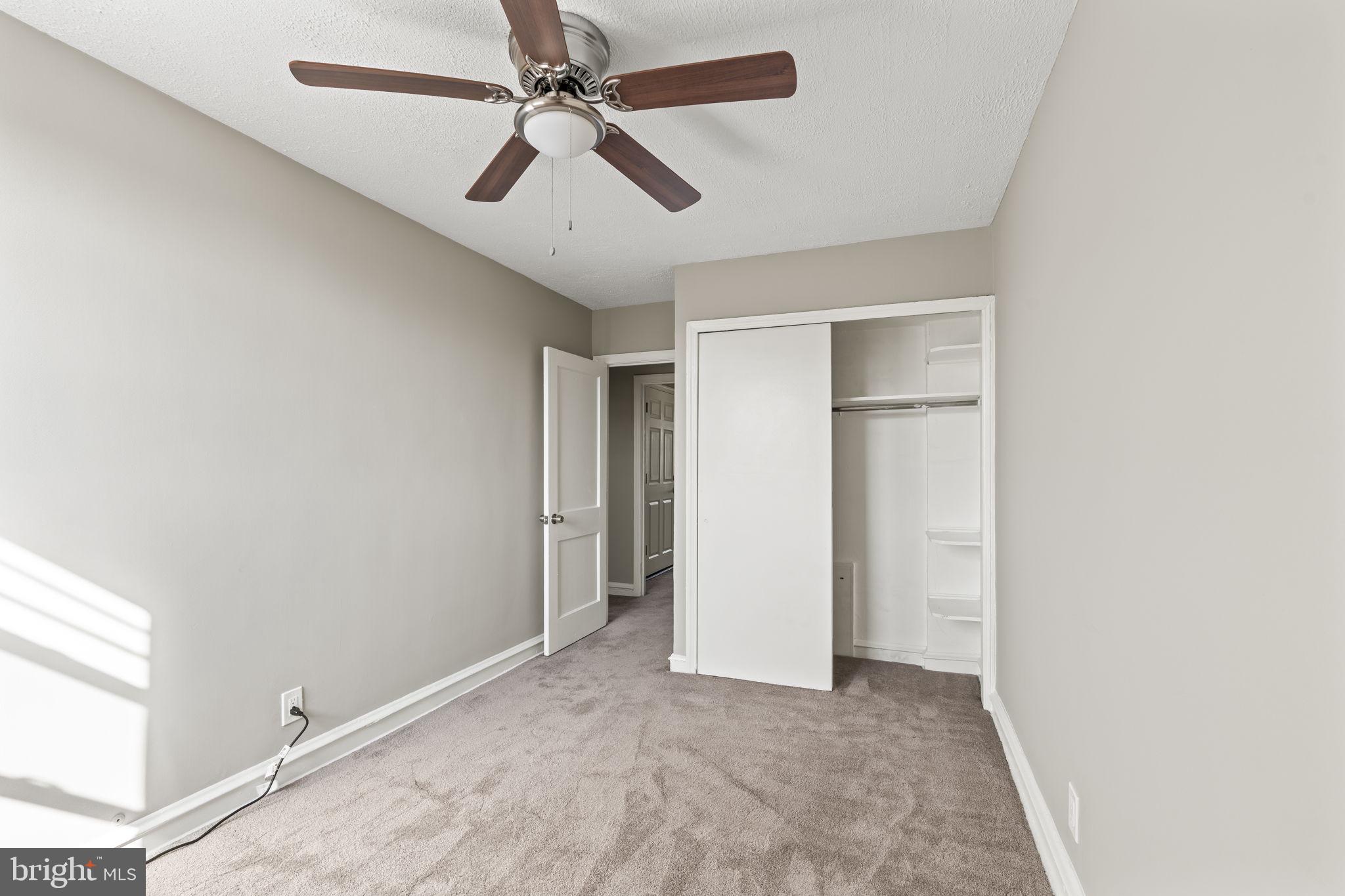 936 Vernon Road, Unit 2 Philadelphia, PA 19150 - Photo 16 of 19 a view of a livingroom with a ceiling fan and window