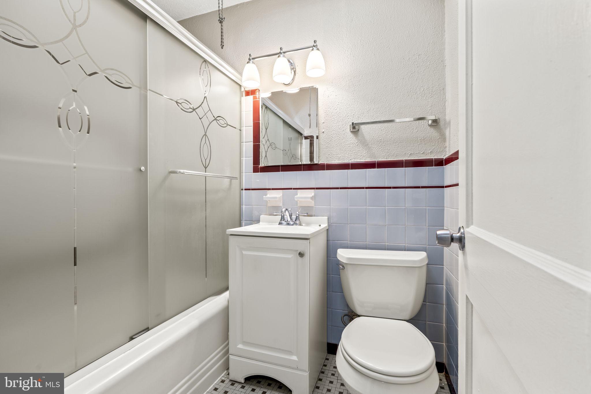 936 Vernon Road, Unit 2 Philadelphia, PA 19150 - Photo 17 of 19 a bathroom with a toilet a sink and bathtub