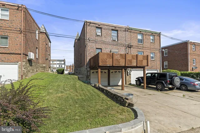 a view of a cars park in front of house