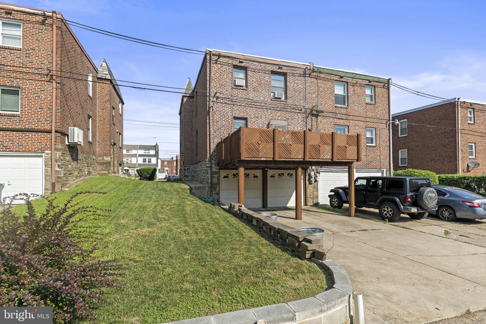 936 Vernon Road, Unit 2 Philadelphia, PA 19150 - Photo 18 of 19 a view of a cars park in front of house