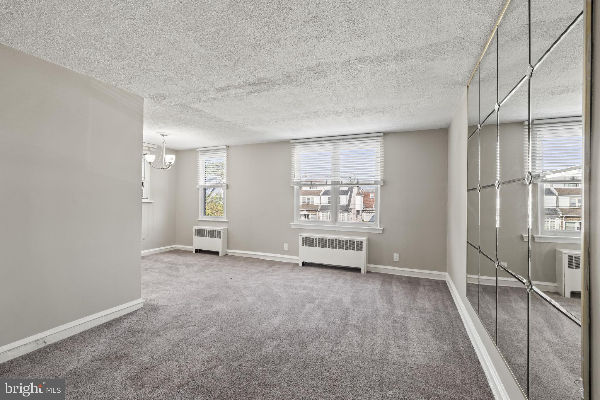 936 Vernon Road, Unit 2 Philadelphia, PA 19150 - Photo 6 of 19 a view of room with hardwood