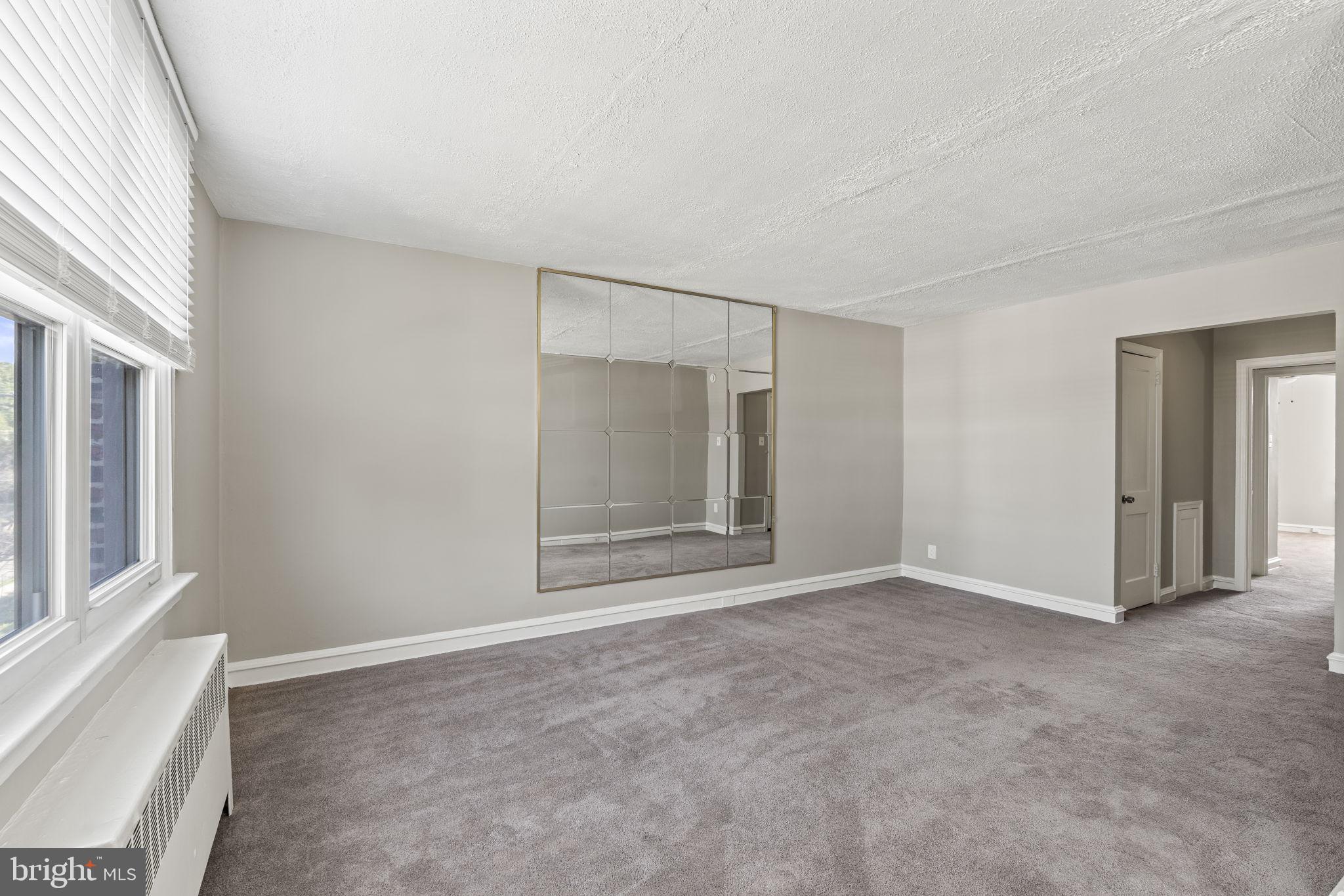 936 Vernon Road, Unit 2 Philadelphia, PA 19150 - Photo 7 of 19 a view of an empty room with a window