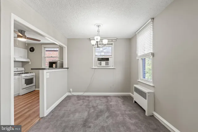 a kitchen that has a lot of windows and sink