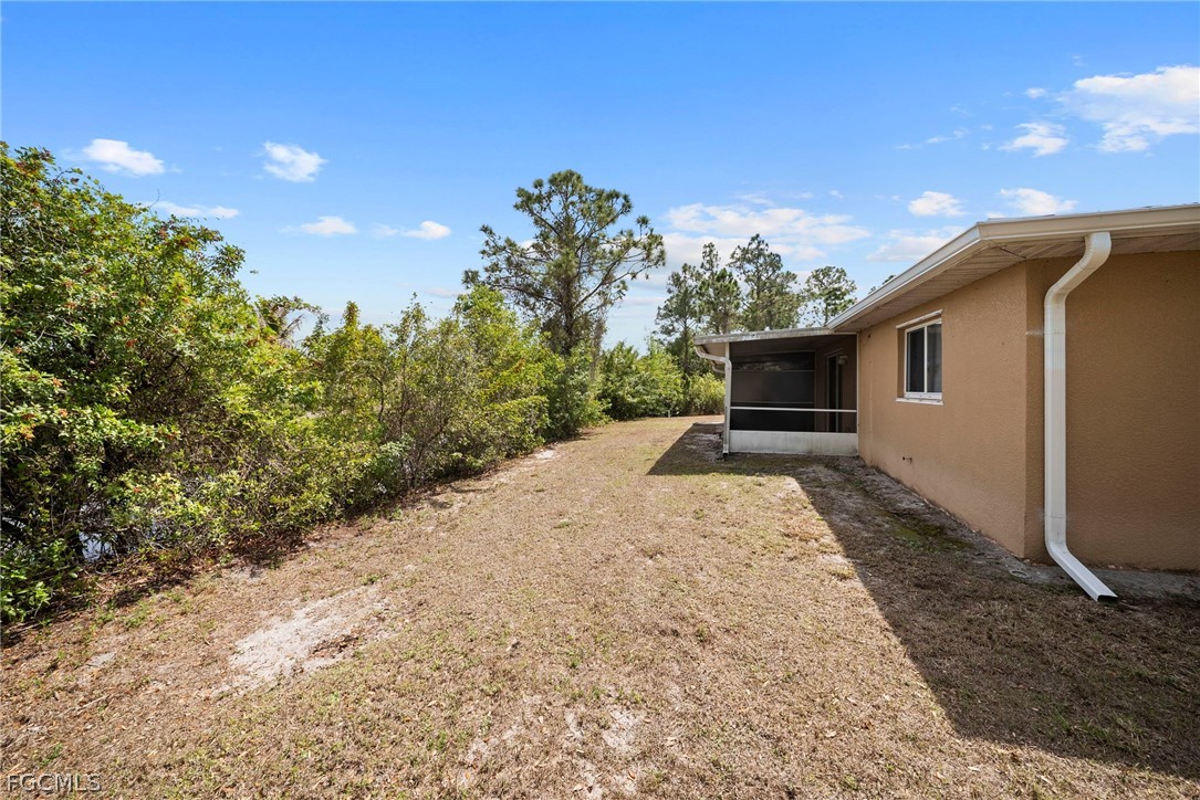 4838 29th Street Southwest Lehigh Acres, FL 33973 - Photo 23 of 25 a view of backyard of house