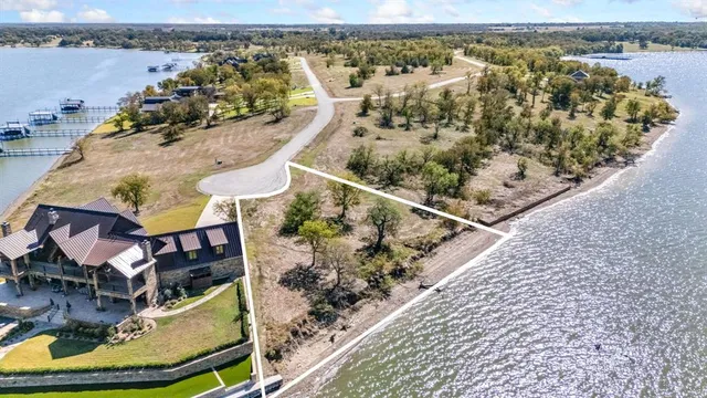an aerial view of a house with a swimming pool