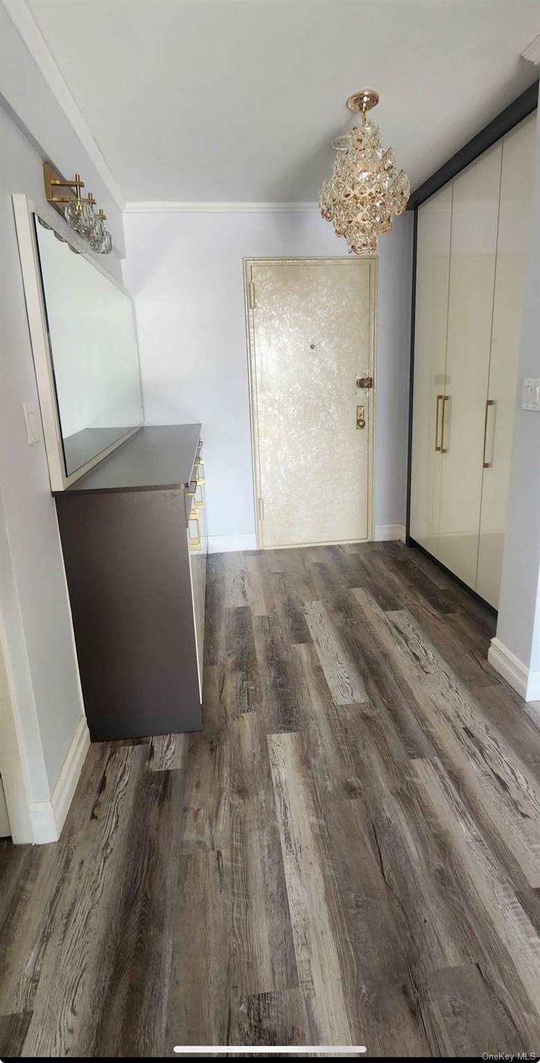 141-60 84th Road, Unit 6A Queens, NY 11435 - Photo 2 of 17 a view of a room with wooden floor and staircase