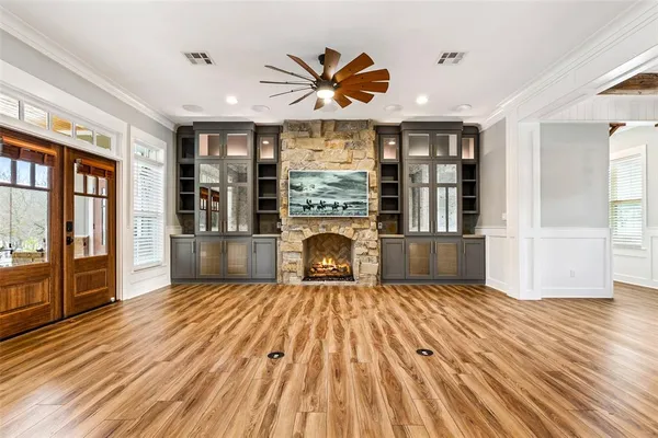 a view of livingroom with hardwood floor and a fireplace