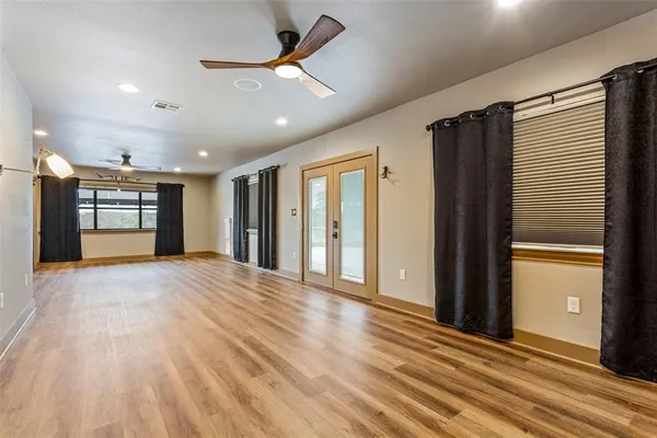 a kitchen with stainless steel appliances kitchen island granite countertop a sink a counter space and cabinets