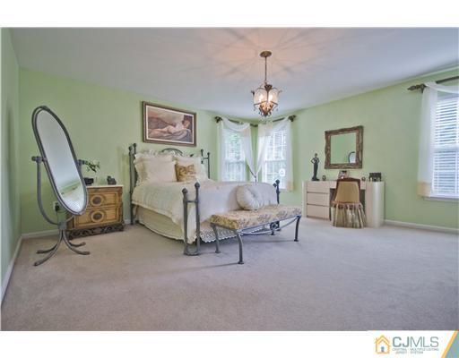 12 Stewart Court Old Bridge, NJ 08857 - Photo 12 of 14 a living room with furniture and a chandelier