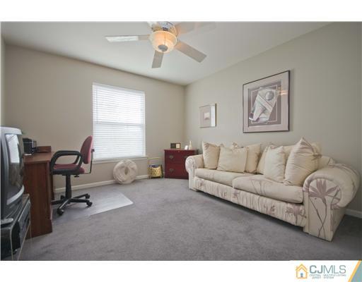 12 Stewart Court Old Bridge, NJ 08857 - Photo 14 of 14 a living room with furniture and a window