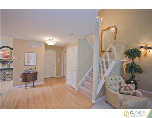 12 Stewart Court Old Bridge, NJ 08857 - Photo 3 of 14 a living room with furniture and a potted plant