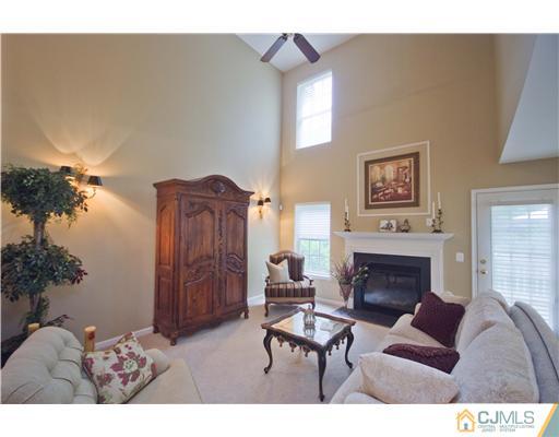 12 Stewart Court Old Bridge, NJ 08857 - Photo 6 of 14 a living room with furniture and a fireplace