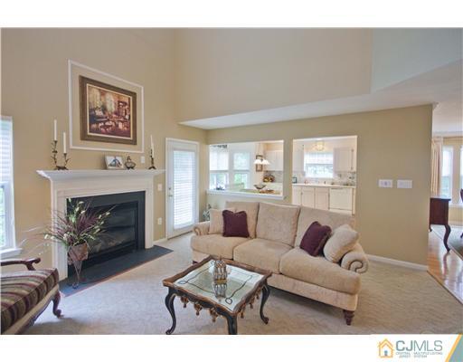 12 Stewart Court Old Bridge, NJ 08857 - Photo 8 of 14 a living room with furniture and a fireplace