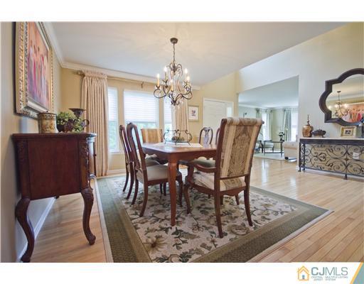 12 Stewart Court Old Bridge, NJ 08857 - Photo 9 of 14 a view of a dining room with furniture and wooden floor