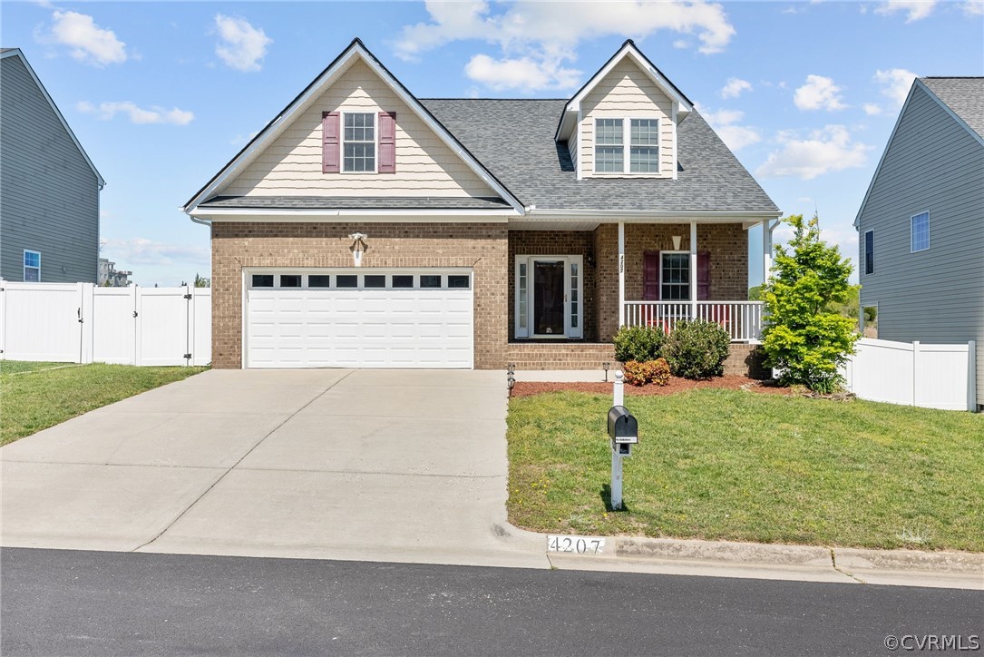 4207 Eagle Drive Hopewell, VA 23860 - Photo 1 of 28 a front view of a house with a yard