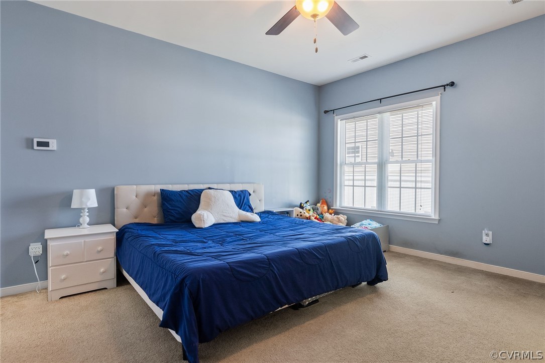 4207 Eagle Drive Hopewell, VA 23860 - Photo 13 of 28 a bedroom with a bed and a large window