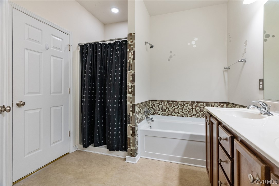 4207 Eagle Drive Hopewell, VA 23860 - Photo 15 of 28 a bathroom with a shower a sink and a mirror