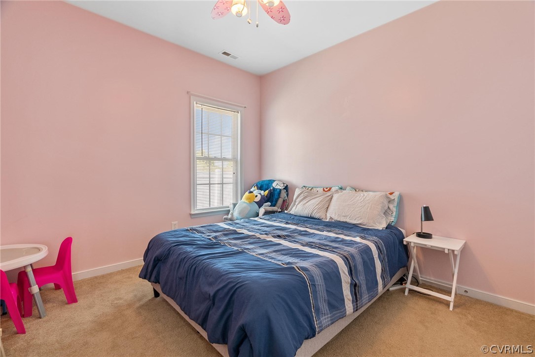 4207 Eagle Drive Hopewell, VA 23860 - Photo 16 of 28 a large bed sitting in a bedroom next to a window