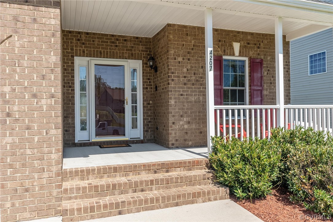 4207 Eagle Drive Hopewell, VA 23860 - Photo 2 of 28 a view of a brick house with potted plants