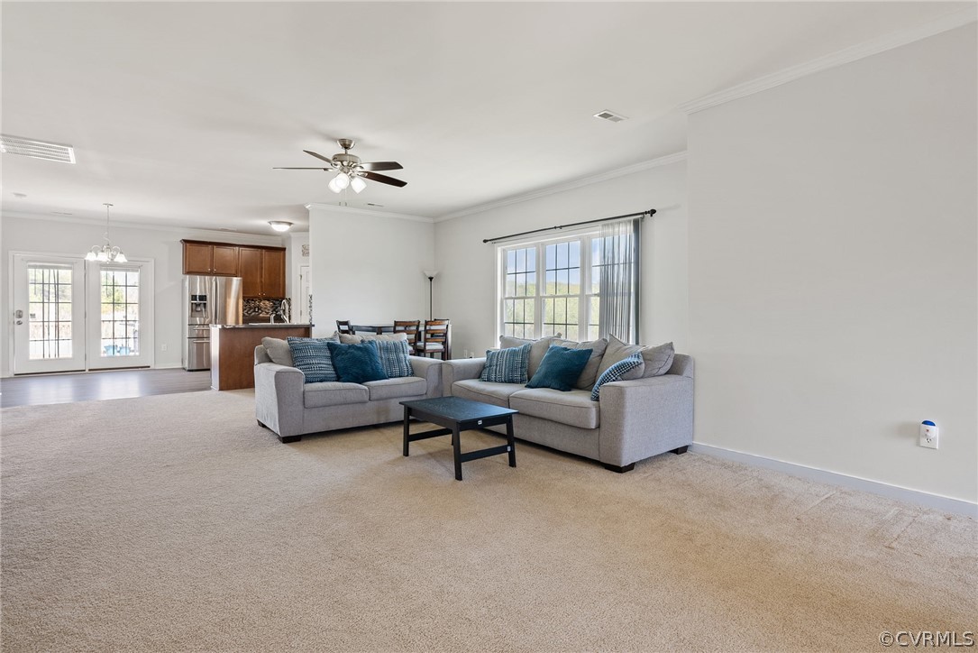 4207 Eagle Drive Hopewell, VA 23860 - Photo 3 of 28 a living room with furniture and a chandelier