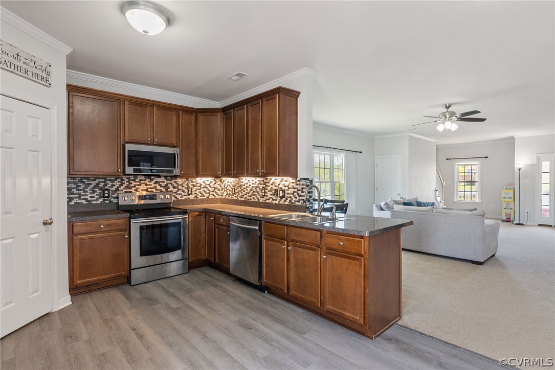 4207 Eagle Drive Hopewell, VA 23860 - Photo 9 of 28 a kitchen with granite countertop a sink stove and cabinets
