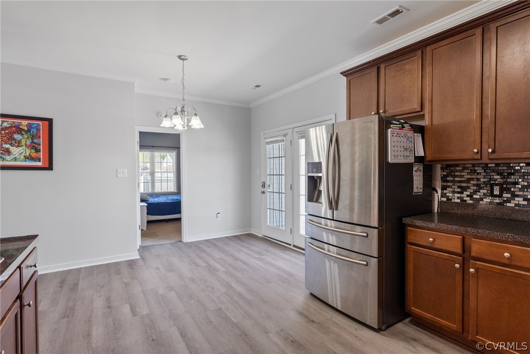 4207 Eagle Drive Hopewell, VA 23860 - Photo 10 of 28 a kitchen with granite countertop stainless steel appliances and wooden floor