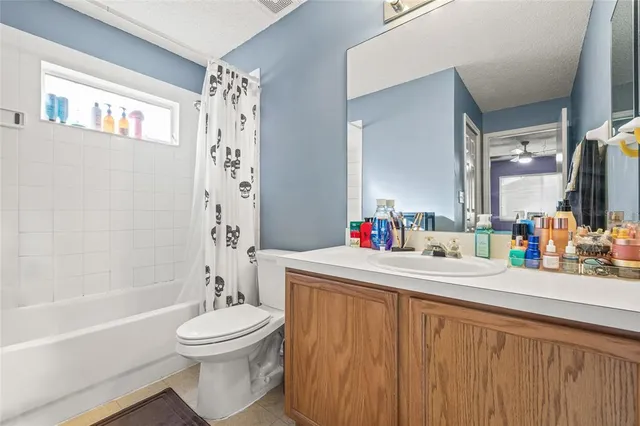 a bathroom with a sink a toilet and a bathtub
