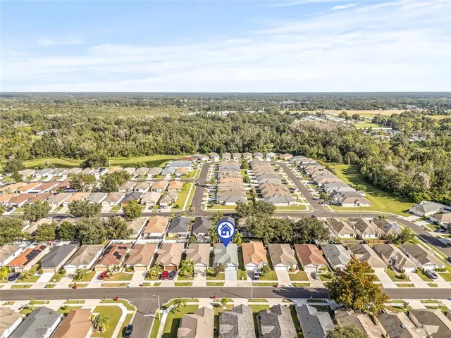 an aerial view of residential building and parking space