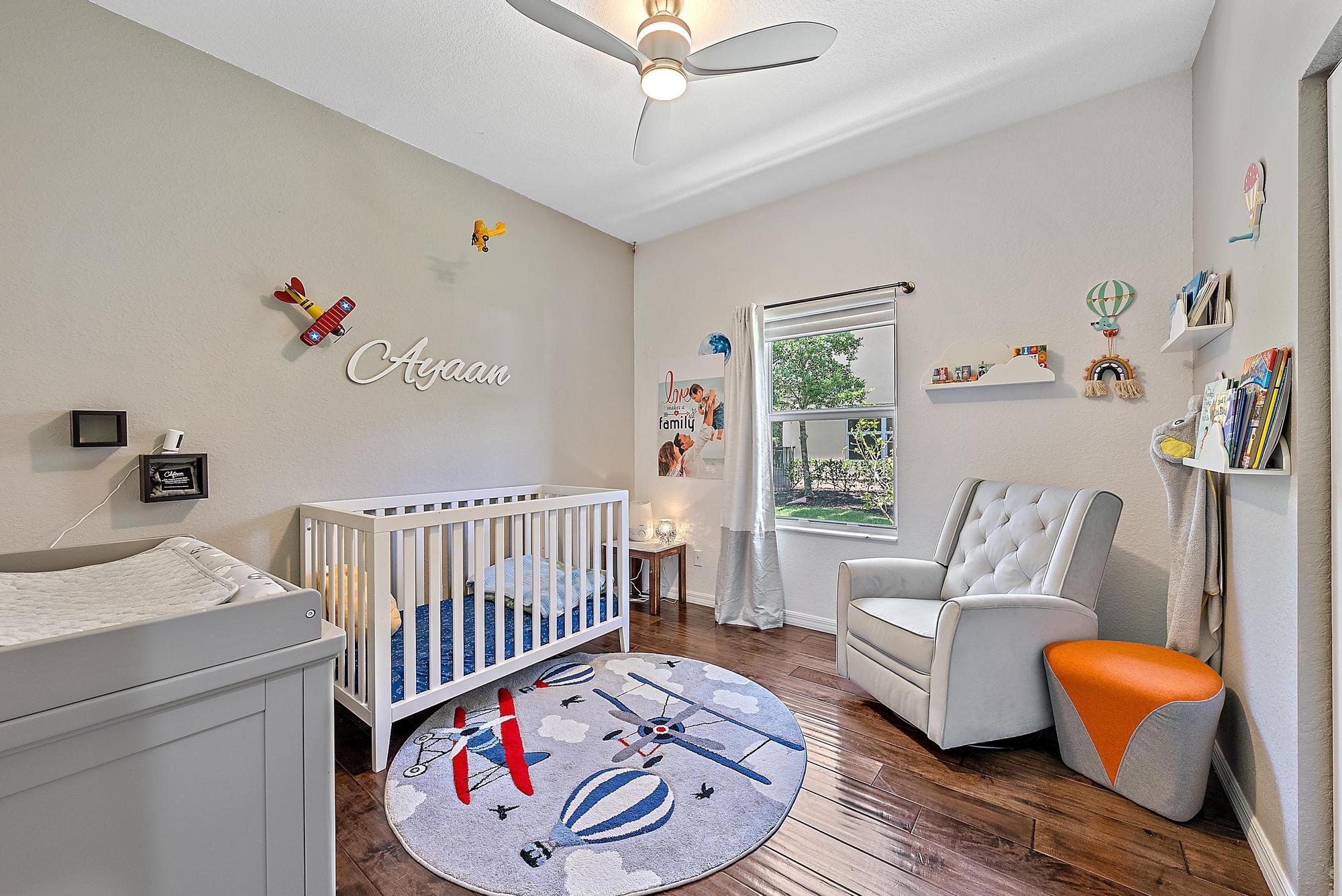 119 Whale Cay Way Jupiter, FL 33458 - Photo 15 of 46 a bedroom with furniture and a window