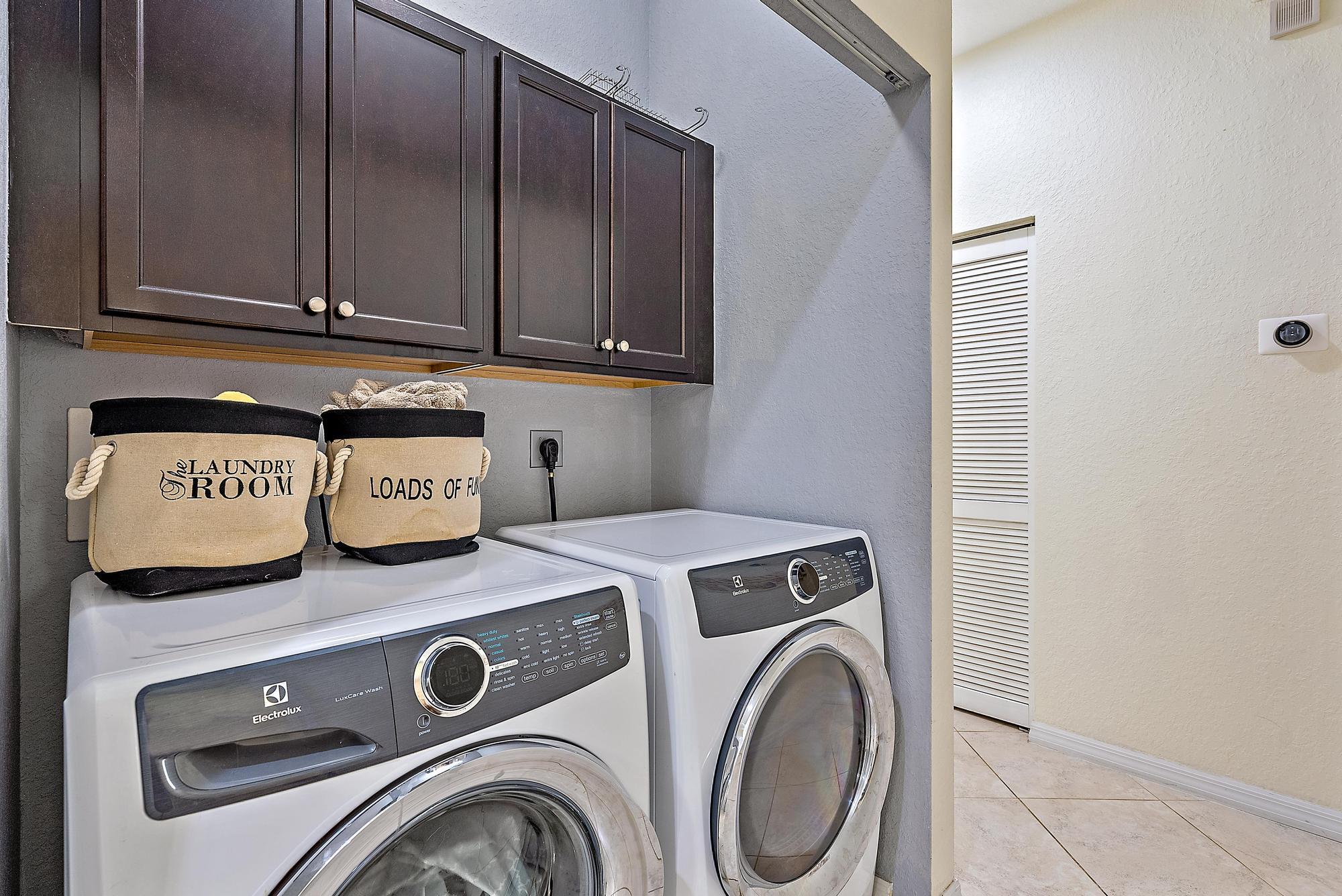 119 Whale Cay Way Jupiter, FL 33458 - Photo 21 of 46 a utility room with dryer and washer