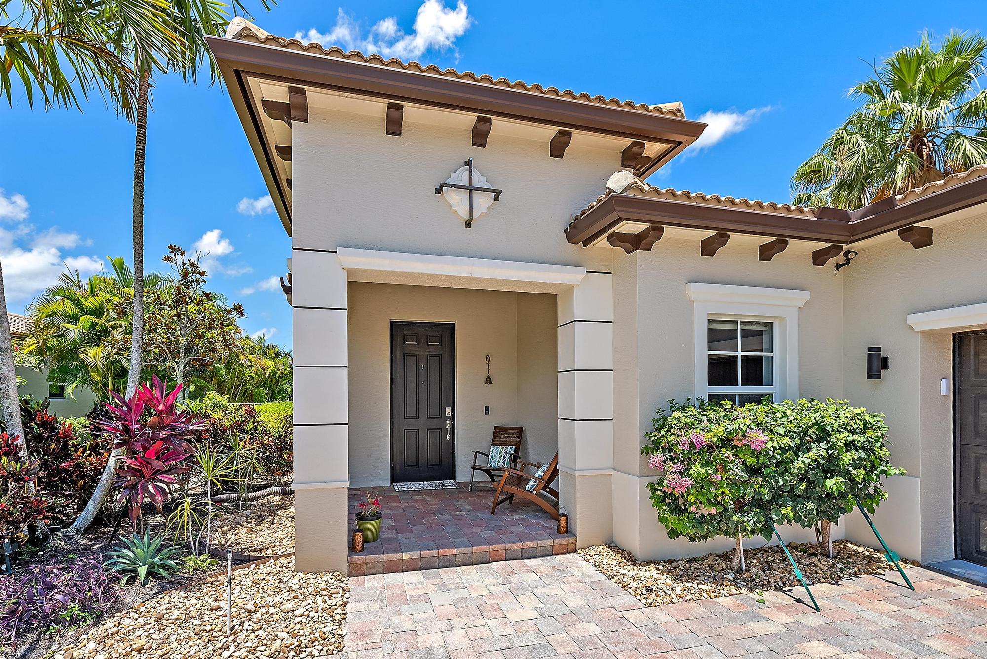 119 Whale Cay Way Jupiter, FL 33458 - Photo 22 of 46 a front view of a house