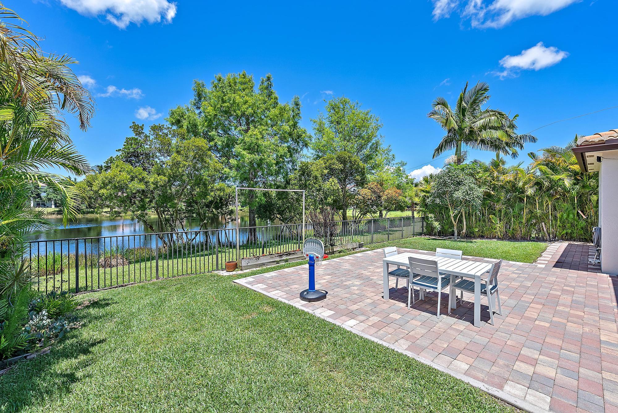 119 Whale Cay Way Jupiter, FL 33458 - Photo 26 of 46 a view of yard with seating and green space