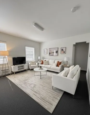 a living room with furniture and a couch