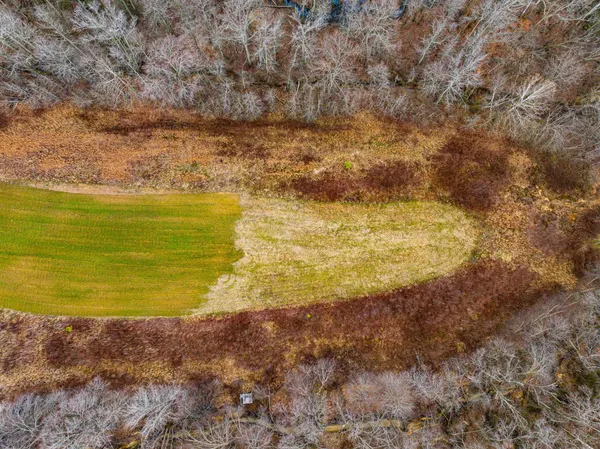 a view of a lake with houses in the back