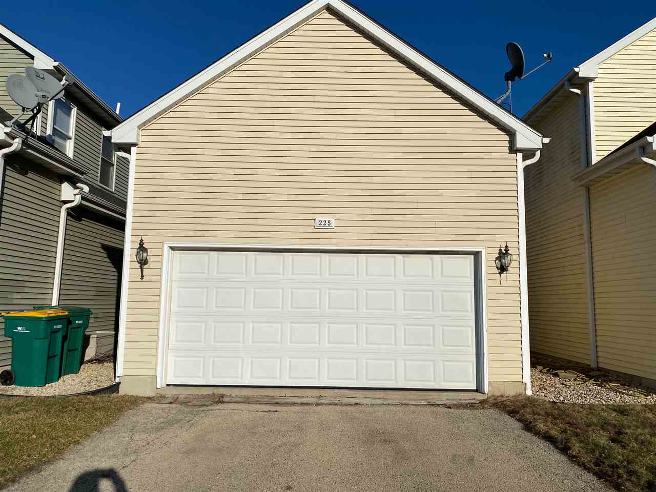 225 Market Street Genoa, IL 60135 - Photo 2 of 13 a view of a house with garage