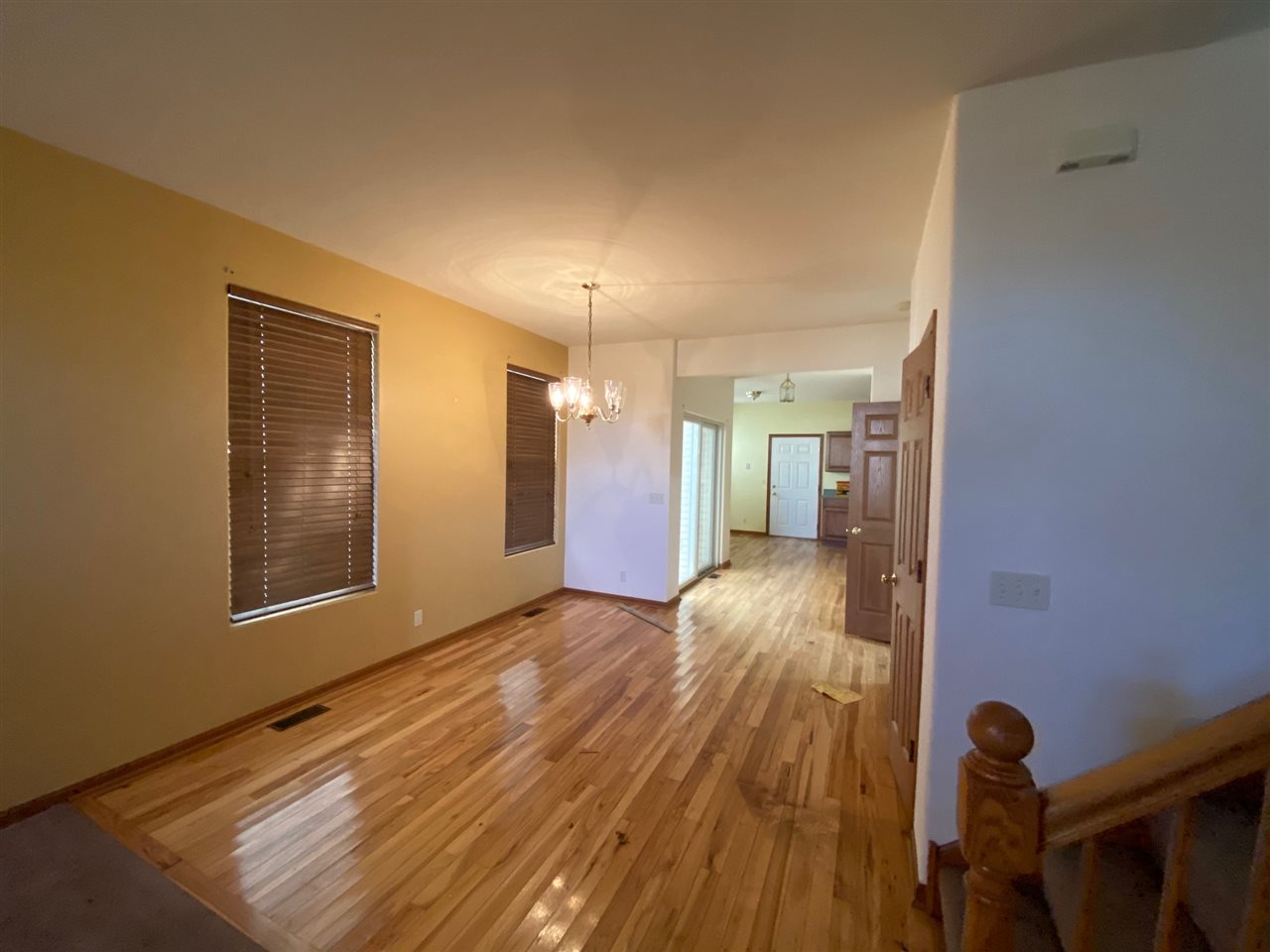 225 Market Street Genoa, IL 60135 - Photo 5 of 13 a view of hallway with wooden floor