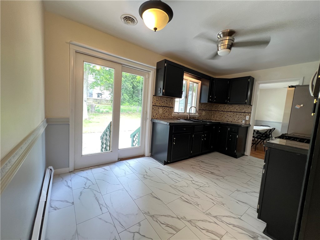 793 Helendale Road Irondequoit, NY 14609 - Photo 22 of 40 Eat In Kitchen with sliding doors to patio