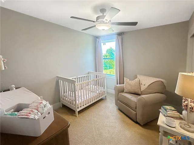 a bedroom with furniture and a window