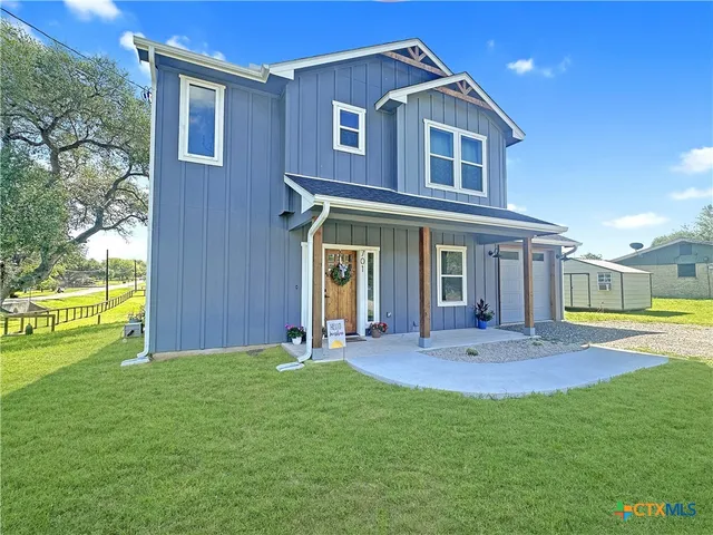 front view of a house with a yard