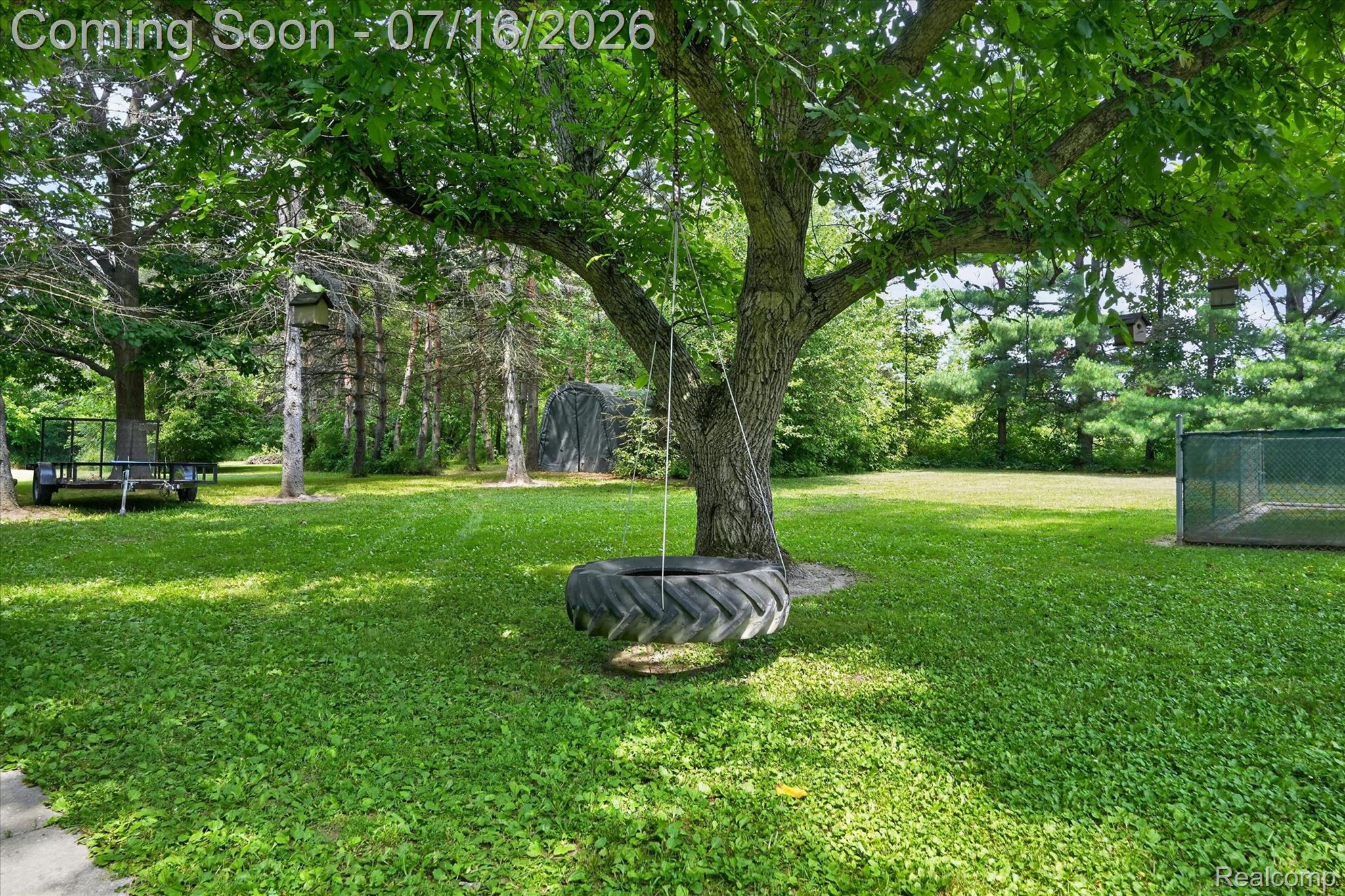 11210 Linden Road Linden, MI 48451 - Photo 38 of 61 Expansive green space featuring mature trees and established greenery