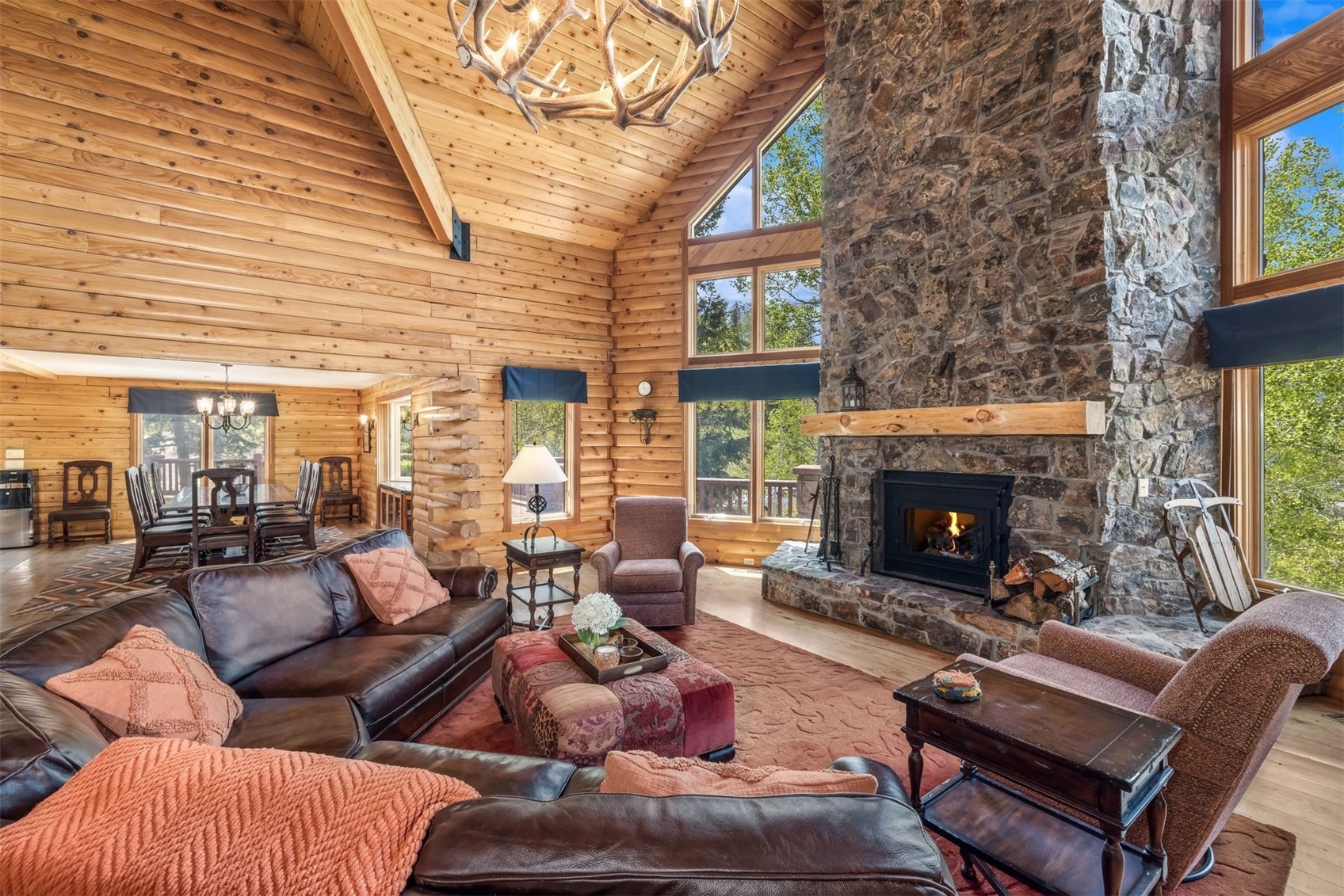 2244 Johnson Road Silverthorne, CO 80498 - Photo 1 of 50 a living room with furniture a fireplace and a large window