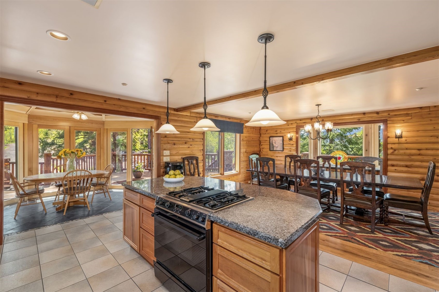 2244 Johnson Road Silverthorne, CO 80498 - Photo 13 of 50 a kitchen with a stove a sink a counter top space and living room view