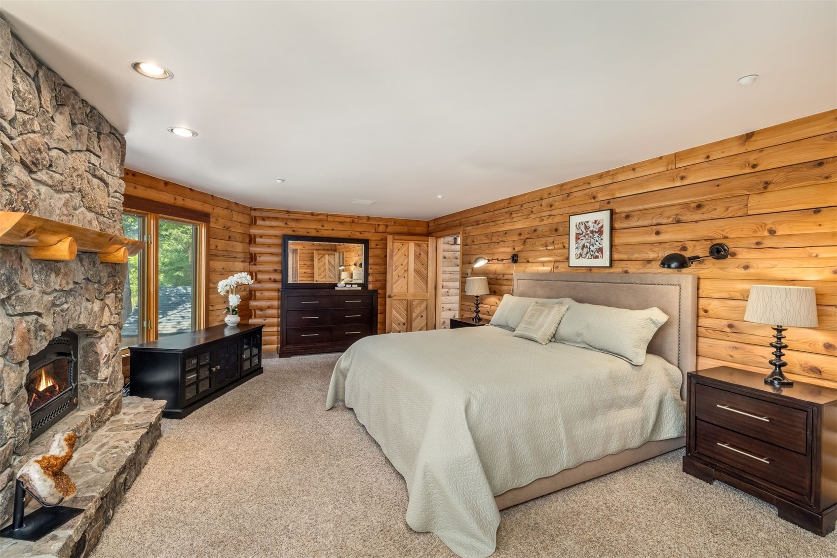 2244 Johnson Road Silverthorne, CO 80498 - Photo 20 of 50 a spacious bedroom with a large bed and a dresser