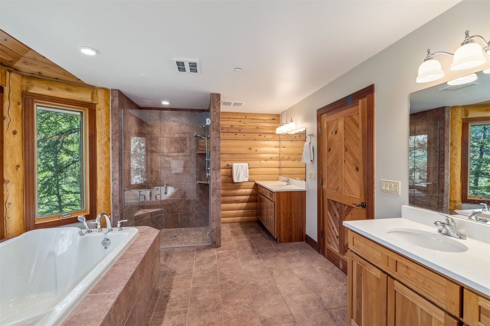 2244 Johnson Road Silverthorne, CO 80498 - Photo 21 of 50 a bathroom with a granite countertop tub sink toilet and shower