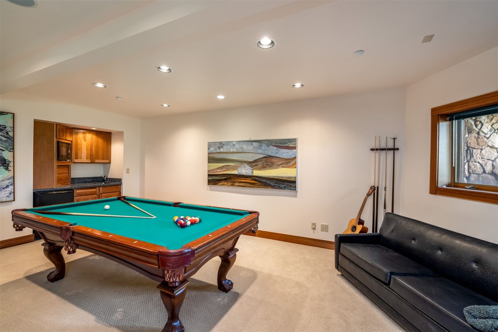 2244 Johnson Road Silverthorne, CO 80498 - Photo 32 of 50 a living room with furniture pool table and flat screen tv