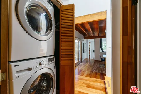 a view of a hallway with washer and dryer